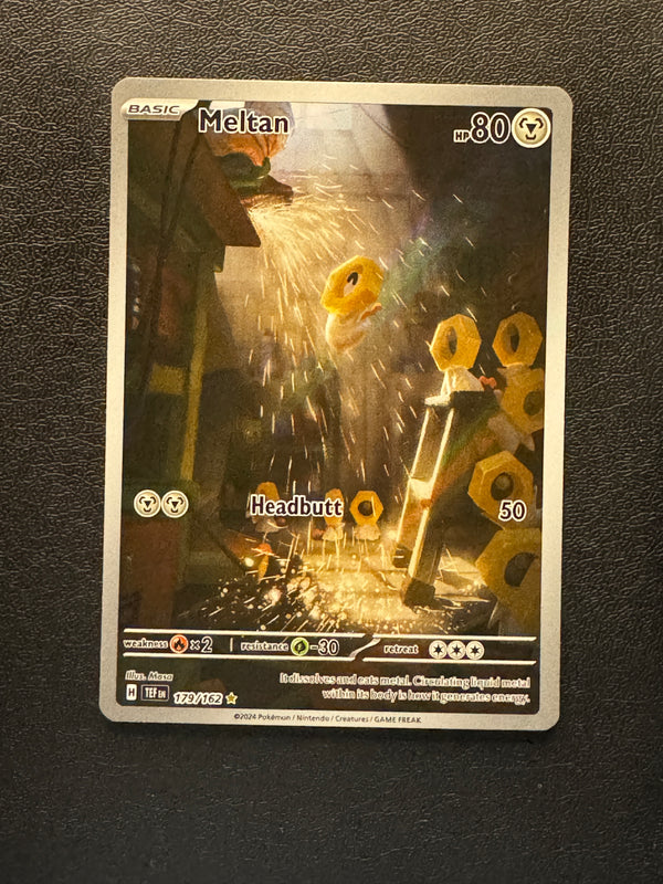 179 Meltan Temporal Forces Illustration Rare Near Mint