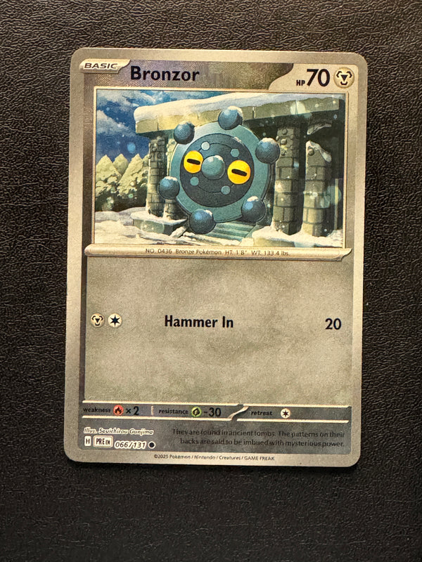 066 Bronzor [Master Ball] Prismatic Evolutions Common Near Mint