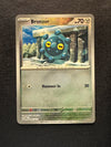 066 Bronzor [Poke Ball] Prismatic Evolutions Common Near Mint